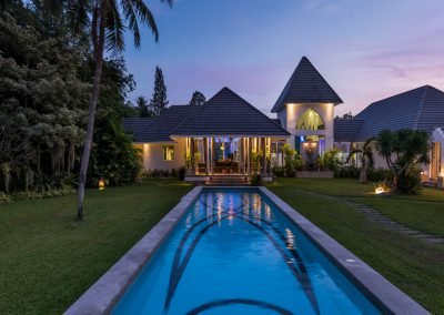 Exterior photo at sunset of a pool villa in Pattaya, Thailand.