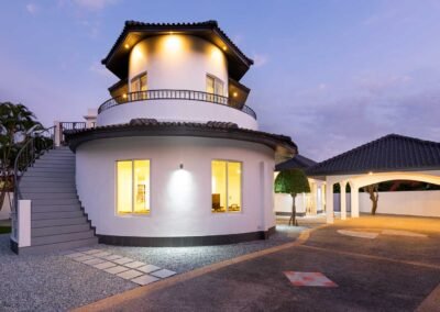 Exterior twilight photo of a villa in Pattaya, Thailand. Captured by an Bangkok based professional real estate photographer.