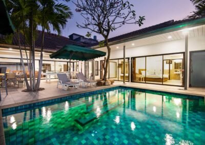 Twilight photo of a pool villa in Pattaya, Thailand.
