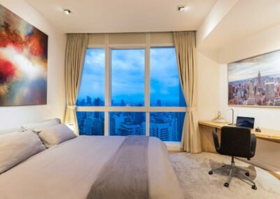 Modern bedroom at the Millennium Residence in Bangkokwith city view. Captured by Real Estate Photography Thailand.