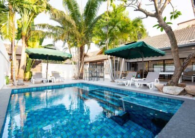 Tropical villa with pool and palm trees in Pattaya Thailand. Real Estate Photography Thailand.