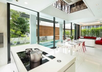 Modern kitchen with open living space in a Townhouse in Bangkok. Photo is taken by Real Estate Photography Thailand.