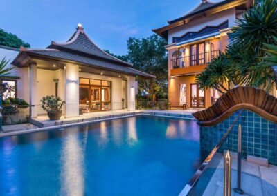 Exterior twilight photo of a modern pool villa n Pattaya. Real estate photography service in Thailand.