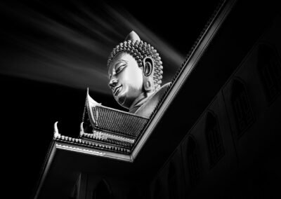 Head of the gigantic buddha at Wat Prak Nam in Thonburi, Bangkok. Black and white architecture photography.