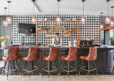 Stylish bar with elegant seating at a hotel in Bangkok, Thailand. Captured by a professional interior photographer.