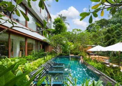 Lush garden with serene swimming pool. Bangkok based hotel photographer is available for assignments all over Thailand.
