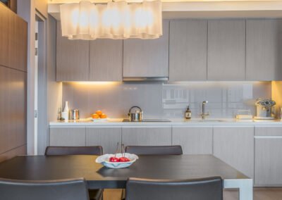 Interior photography of a minimalist kitchen design in a condo in Bangkok. Professional real estate photography service in Thailand.