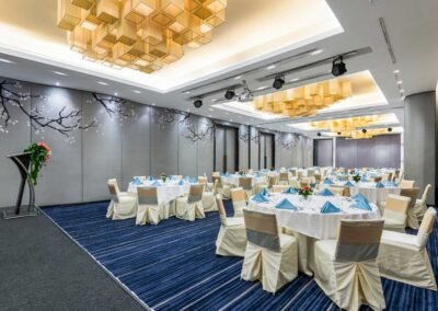 Elegant banquet hall with round tables at a hotel in Bangkok, Thailand. Captured by a professional hotel photographer.