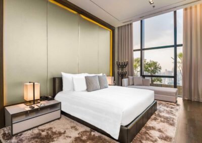 Modern hotel room with city view at Emporium Suites in Bangkok, photographed by a commercial photographer in Thailand.